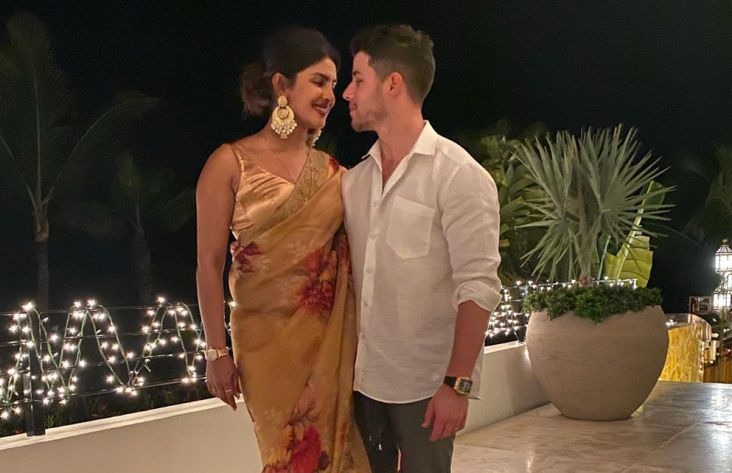 ​PC surprises shirtless Nick with this cute anniversary gift
