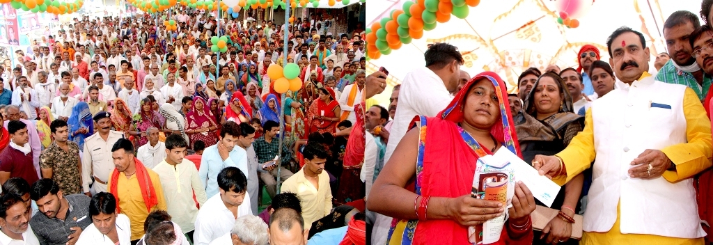 PR Minister Dr. Mishra distributes first installment of Pradhanmantri Awas