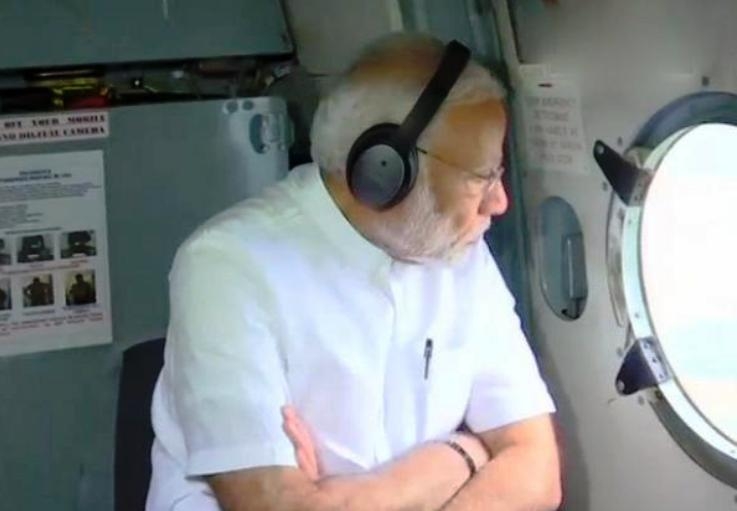 PM in Kerala for aerial survey of flood affected areas, Rahul demands to declare National Disaster 