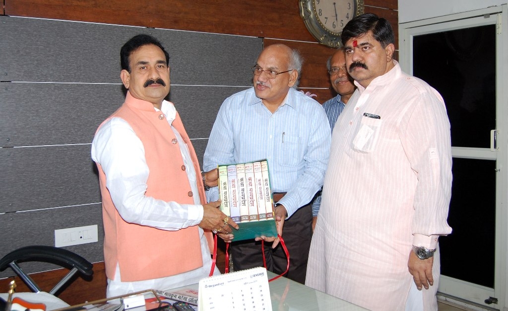 PR Minister Dr. Mishra presented with literature