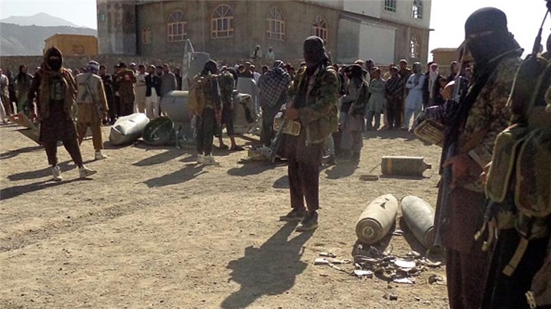  13 killed in battle for control of Afghan district 