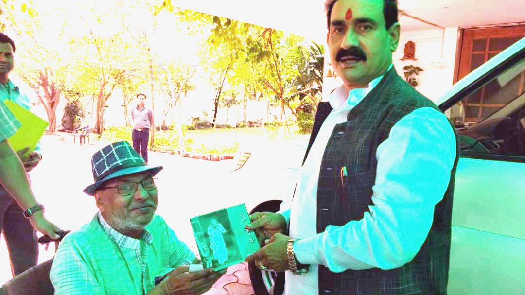 Poetry Collection Presented to PR Minister Dr. Mishra
