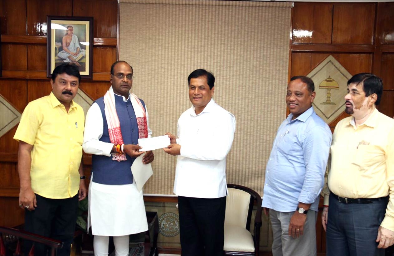 MoS Sarang Hands Over Relief Cheque to Assam CM Sonowal